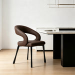 LIVARA Armchair - Premium Leather Upholstery with Sculptural Curved Backrest and Reinforced Metal Frame, Modern Accent Chair for Dining Room - Brown