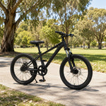 VOLTUS 24 Inch Youth Mountain Bike with 7-Speed Gear System, Disc Brake and Suspension Fork for Outdoor Riding - Black